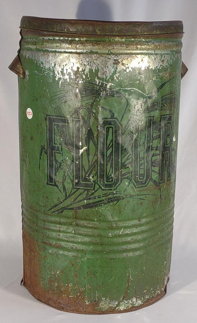 Large General Store Flour Tin: antique large green flour tin with handles and lid. Bottom is rusted and has holes.