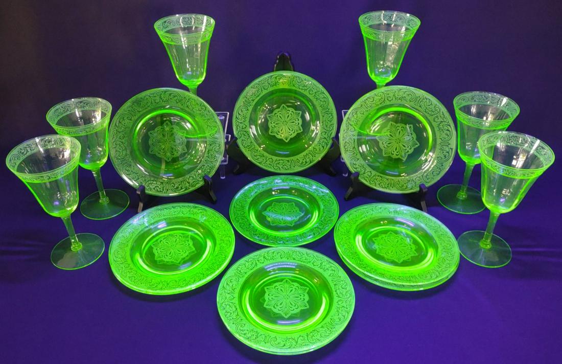 16 pc Uranium Etched Depression Glass Set: Vintage depression era green uranium glass plate and wine glass set with etched scroll pattern. Includes 10 plates and 6 wine glasses. Black light tested. Wine glasses stand 7" tall. Minor chips on a 
