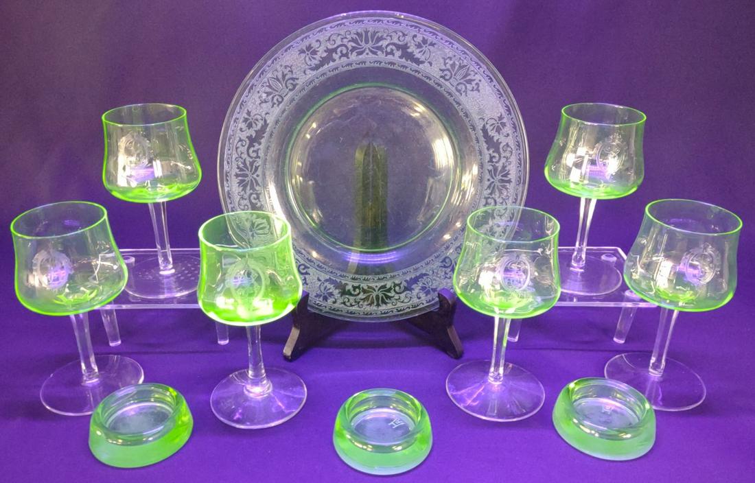 10 pc. Uranium Wine Glasses, Plate & Coasters: 10 piece vintage green uranium glass wine glasses, furniture coasters, and plate. Includes 6 monogrammed wine glasses etched with the letter B, 1 etched plate, and 3 Hazel Atlas furniture coasters.