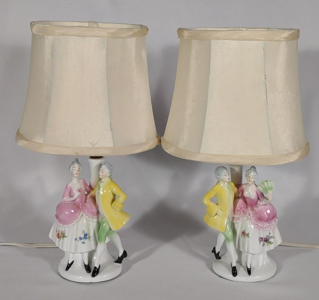 Pair of German Porcelain Victorian Figured Lamps: Matching pair of porcelain lamps with victorian lady and gentleman. Both are tested and work. Bottoms are marked "Germany".