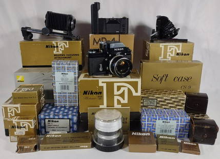 Vtg Nikon F Black Camera, Finder & Accessories: Vintage Nikon F black camera body, serial number 7161120. Shutter works. Attached is a nikon photomic FTn Finder and 1:1.4 50mm lens. Included in this lot is a vast assortment of Nikon accessories