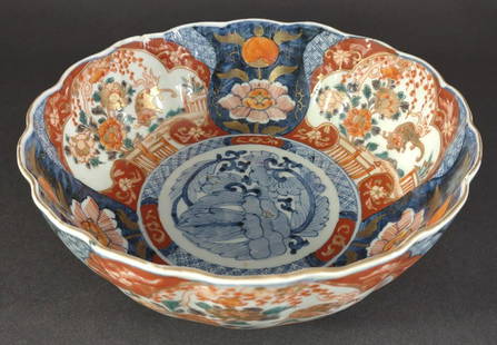 Japanese Imari Porcelain Bowl: Antique Japanese Imari hand painted bowl with scallop edge. Cobalt blue, red and gold colors with slight green detail over blue underglaze. Unmarked base. 9 inches wide by 3.5 inches tall. Small edge