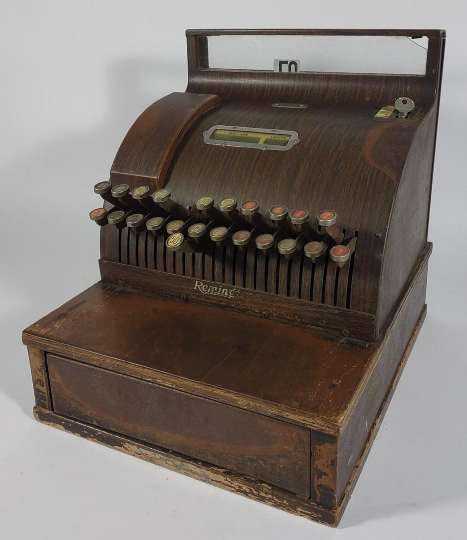 Antique Remington Cash Register C-502 (Read Info): Heavy antique Remington cash register, model C-502. Serial number: 112519. Metal exterior made to look like wood. Includes key to lock and unlock the money tray. Register does open and close, but "50"