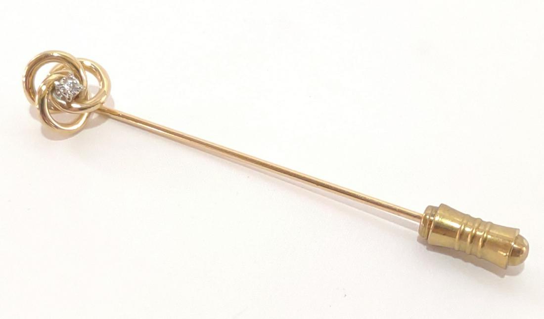 Diamond & 10K Yellow Gold Stick Pin: Vintage 10 karat yellow gold stick pin with knot design and round cut diamond (0.03 ct). Unmarked. Tested for gold purity. Stopper is not gold. Total weight of pin, excluding stopper: 1.87 grams (1.20