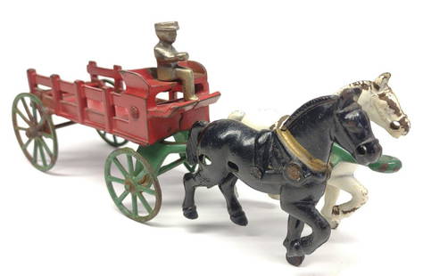 1930s Kenton Horse Drawn Stake Wagon w/ Driver: Circa 1930s Kenton cast iron and metal horse drawn stake wagon with double horses and driver. All original. Made by Kenton Toys.