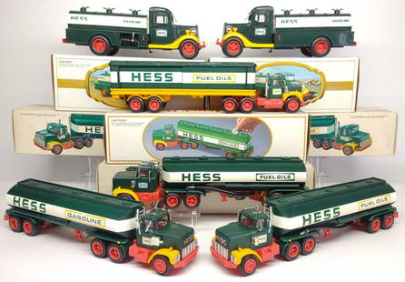 Six 1970s & 80s Hess Toy Trucks in Box: 1976 Hess Box Truck with 4 labeled barrels, 1977 Hess Semi Tanker Truck, 1978 Hess Semi Tanker Truck, 1984 Hess Tanker Bank, Two 1982 â€œFirst Hess Truck” (Red Switch).