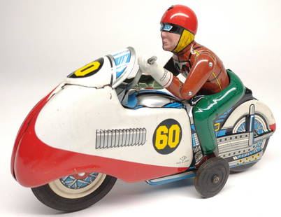 Vintage TN Japan Tin Friction Toy Motorcycle: Vintage, circa 1950s T.N., Made in Japan, friction powered racing motorcycle tin toy. Made by Nomura. Man moved up and down with forward movement.