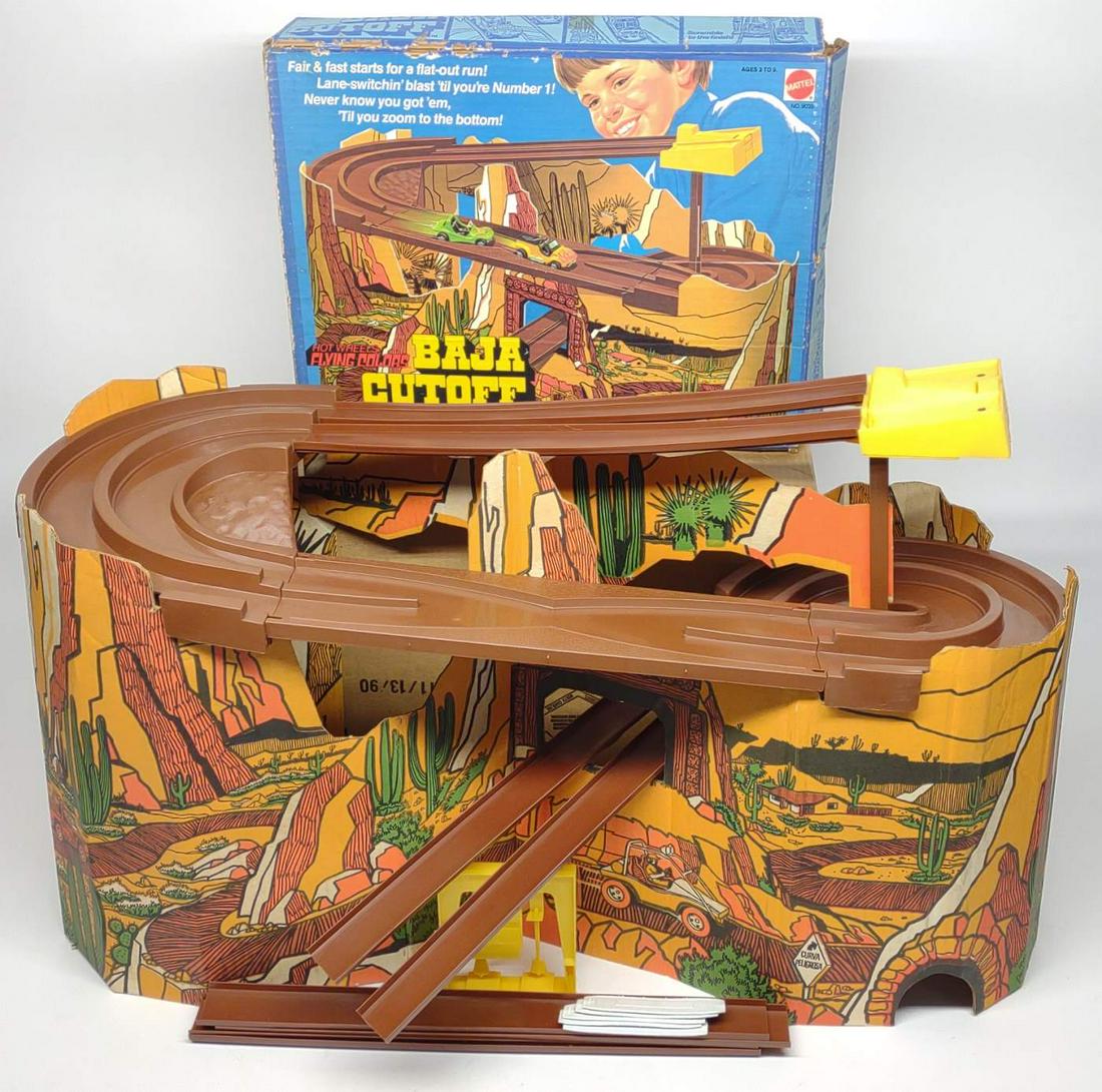 1975 Hot Wheels Flying Colors Baja Cutoff Playset: Vintage 1975 Mattel Hot Wheels Flying Colors Baja Cutoff #9039 race track set in original box. Complete track with cardboard cutout, start and end pieces, and original box. The only thing missing is t