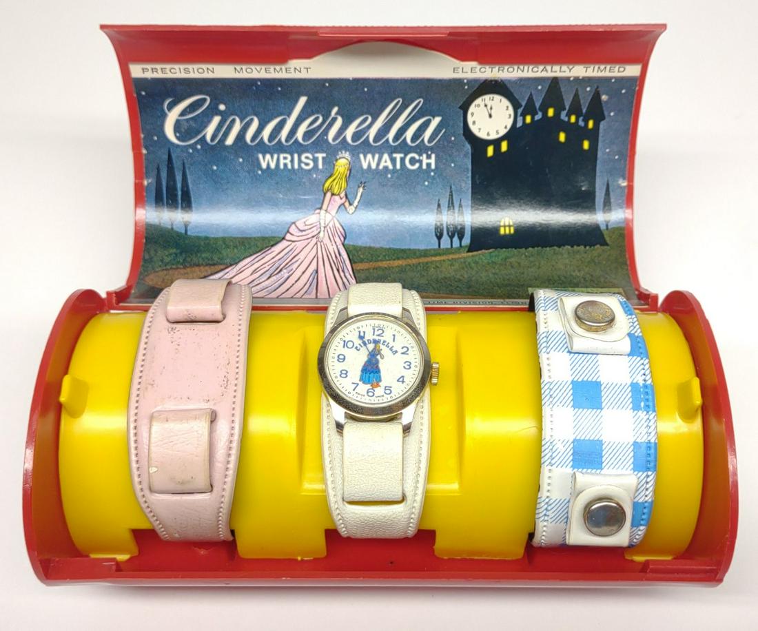 1967 Disney Bradley Cinderella Wrist Watch Set: Vintage 1967 Walt Disney Cinderella wrist watch with interchangeable bands by Bradley. Original packaging / holder. Holder lid is detached. Watch body needs repair. Movement is clean, but does not con