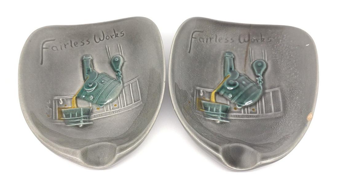 2 Pennsbury Pottery US Steel Ashtrays: Pair of vintage United States Steel Fairless Works ashtrays (Bucks County, PA). Marked Pennsbury Pottery. One ashtray has crazing, 2" crack, and a chip on edge.