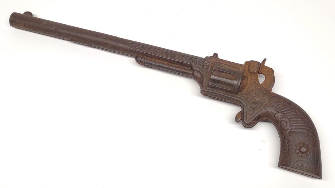 1890s Buffalo Bill Cast Iron Toy Gun: Antique, circa 1890s. 'Buffalo Bill' cast iron toy revolver. Trigger action works. 11.5" long.