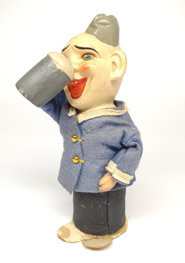 German Drinking Sailor Push Down Toy: An early composite toy of happy sailor drinking beer. When pressed down, his arm lowers and raises. Working condition. Made in Germany.