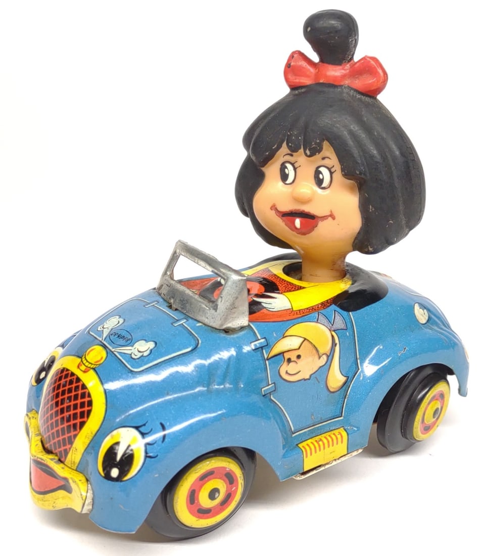 1960s The Telerin Family Wind-Up Walking Car Toy: Vintage, mid to late 1960s, tin wind up walking car toy. Depicts the character Cleo from the 60s spanish television show La Familia Telerin (The Telerin Family). Made by Geyper, Spain. Working conditi