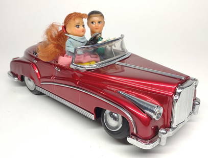 1960s Battery Op. Photoing on Car Tin Toy: Vintage 1960s battery operated toy car, "Photoing on Car". ME-630. This is a mid century china tin toy car. Complete working condition. Drives around with headlights, then stops and girl takes photo w