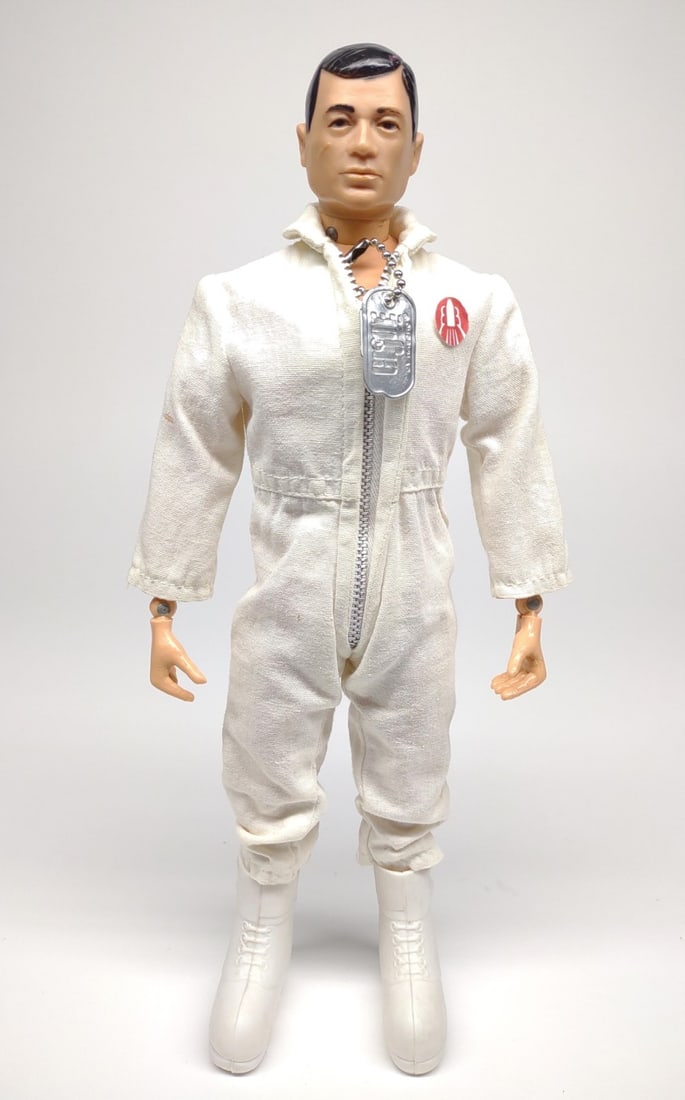1969 GI Joe Talking Astronaut Action Figure: Vintage 1969 Hasbro G.I. Joe Talking Astronaut (7915) with white jump suit and waffle boots. Zipper teeth are in good condition. Stress crack present on each knee. Figure has bee tested and works. Spe