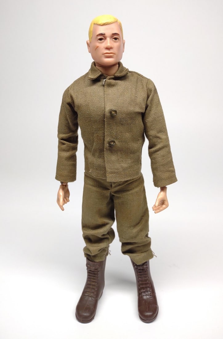 Vintage GI Joe Action Soldier (7500) 1964-65: Vintage 1964-65 Hasbro G.I. Joe Action Soldier with tagged "Hasbro japan" uniform. Backside of figure is marked TM/R Patent Pending. Stress crack on right knee. Also includes dog tag.