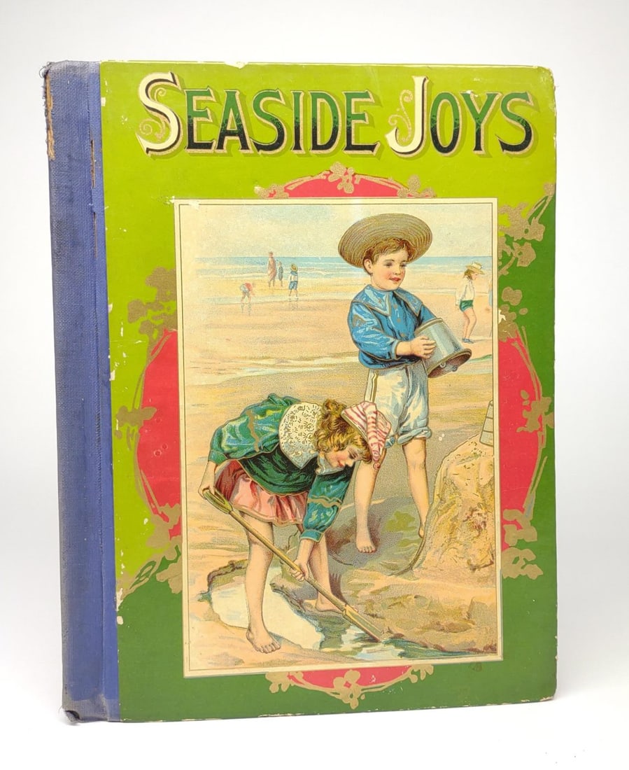 Antique W.B. Conkey Seaside Joys Childrens Book: Seaside Joys for Little People by W.B. Conkey & Co. Circa turn of the century, early 1900s, Minor wear on spine. Vibrant colors on front cover with shiny gold tone paint.