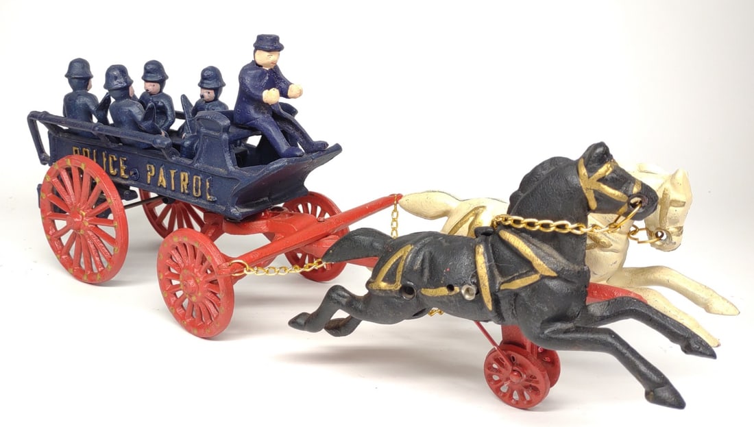 Cast Iron Police Patrol Horse Drawn Wagon (Repro): A reproduction cast iron two horse drawn police patrol wagon with driver and 4 officers in cart. 18" long.