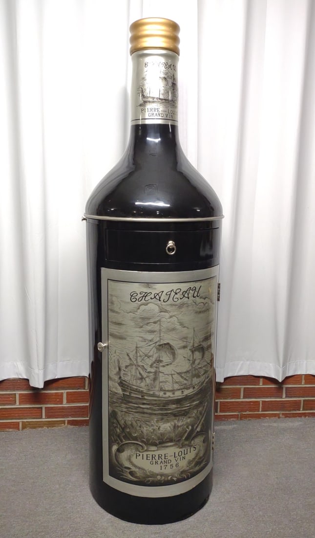 Large Bottle Bar Cabinet (5' tall): A large 5' 4" wine bottle shaped liquor / bar cabinet. Made of wood. Features a felt lined pull our drawer, rotating glass and bottle rack, pull out side table / shelf, and removable top with hidden b