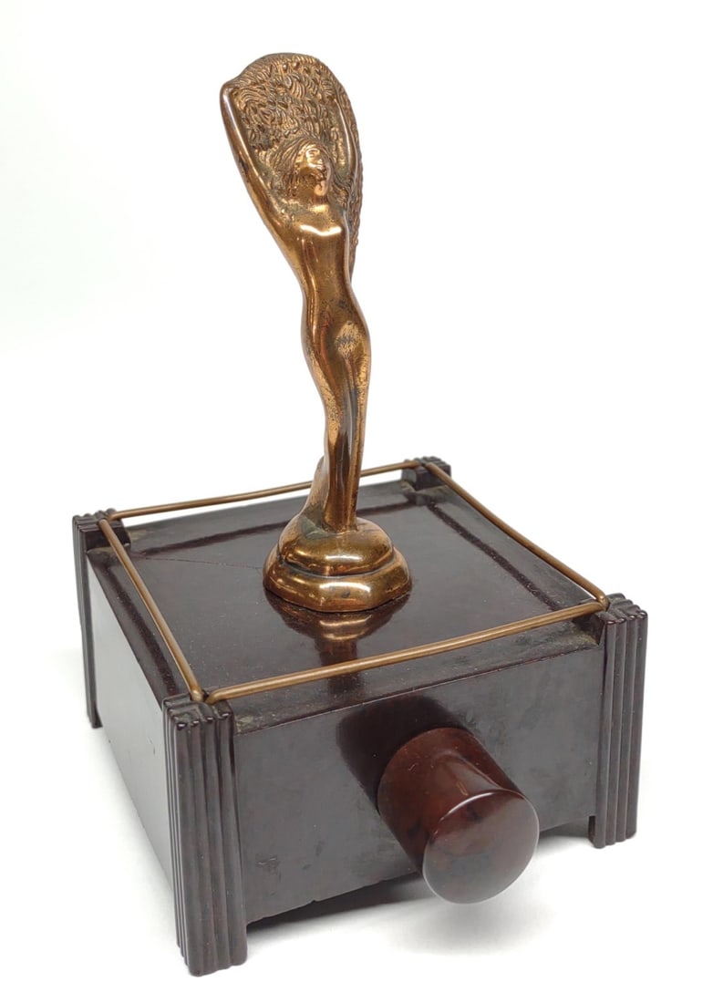 Dunhill Silent Flame Table Lighter of Nude Woman: Circa 1930s, vintage art deco period. Made by Dunhill. Electric cigar table lighter. Known as the “Fan Dancer” or “Sally Rand”. Untested. Base is made of bakelite. Cracked down corner