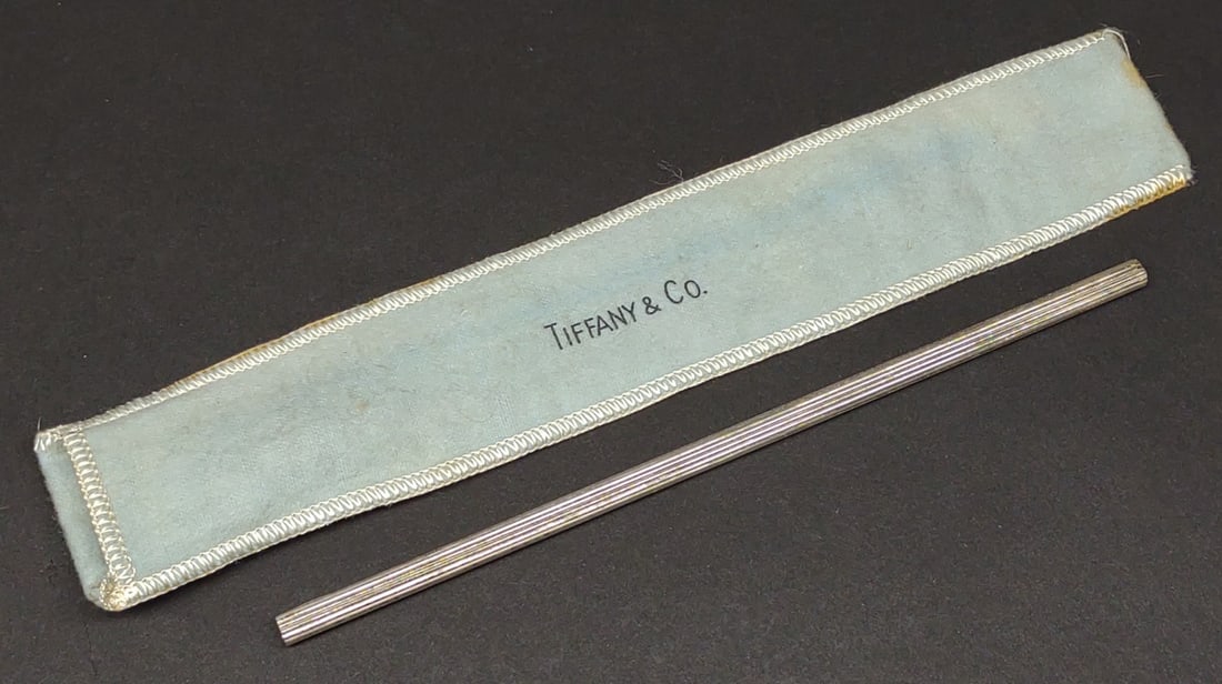 Tiffany Sterling Silver Straw W/ Pouch: A tiffany & Co. sterling silver straw w/ original pouch. Marked "Tiffany & Co. Sterling". Tested for silver purity. Total weight: 11.18 grams.