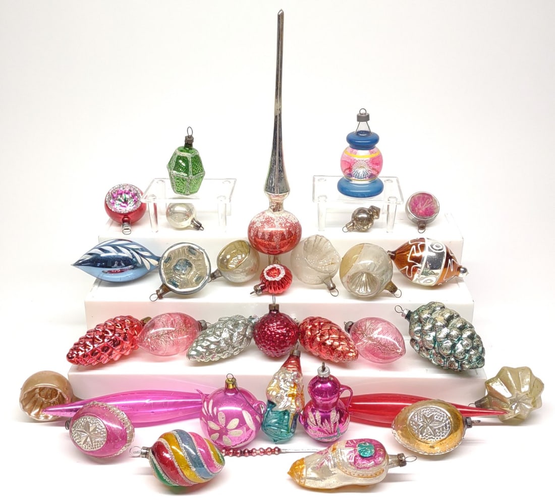 32 Vintage Figural Glass Christmas Ornaments: A mix of 32 figural vintage glass Christmas tree ornaments including pinecone shape, indent shape, tea pot shape, figural shoe, Santa, lantern shape & more. includes mercury glass tree topper.In-house