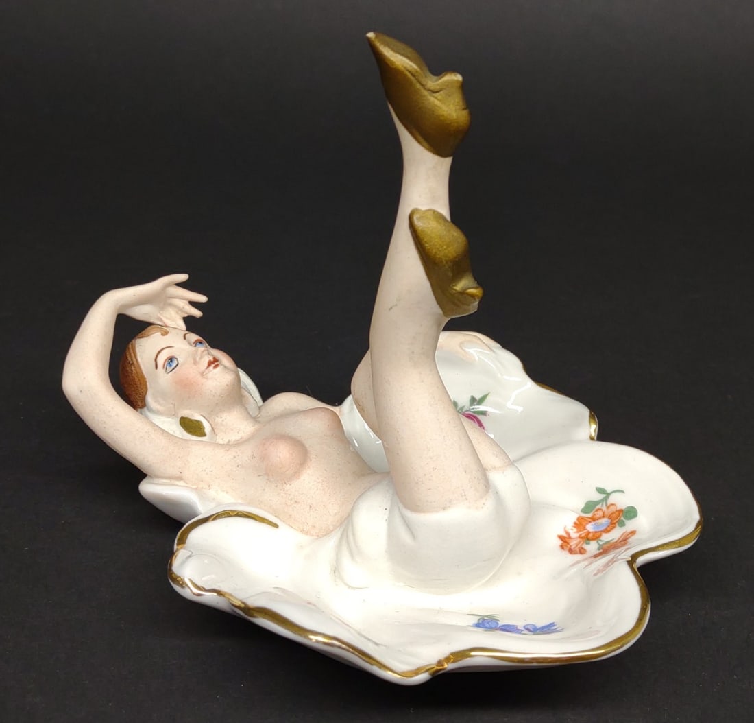 Vintage German Nude Woman Ashtray: A vintage, CICO Bavarian, Germany porcelain painted ashtray with a figural nude lady laying down with legs in the air. Good condition.In-house International shipping NOT available for this item. UPS t