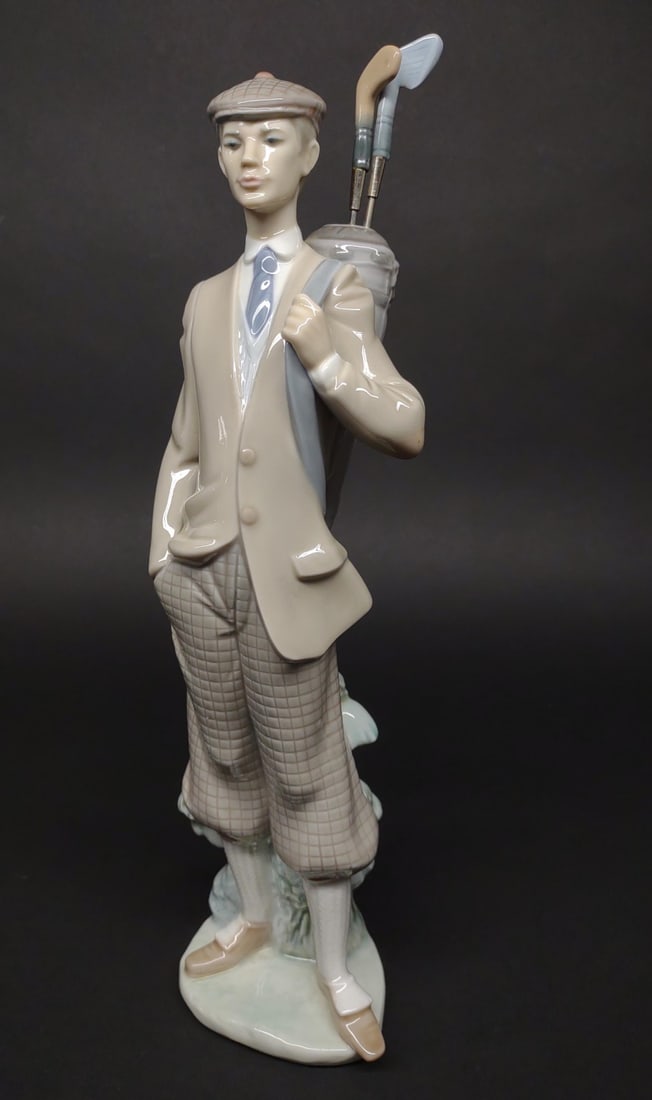 Lladro Waiting To Tee Off #5301 Porcelain Figure: Lladro golf porcelain figurine, good condition, stands 11 1/2" tall.In-house International shipping NOT available for this item. UPS third party or private arrangement only.