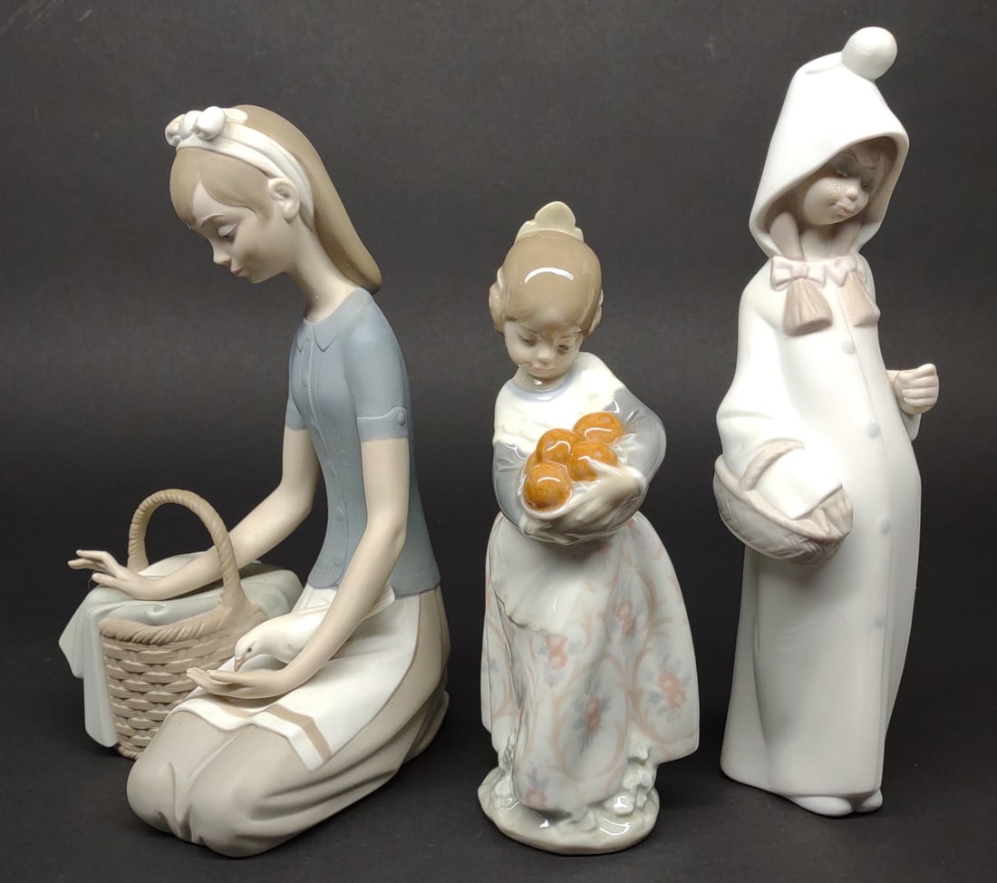 3 Lladro Basket Girl Figures (#4909, 4841, 4678): A group of 3 porcelain Lladro figurines of girls holding baskets. Pieces include #4909 Girl feeding dove, #4841 Valencia girl, and #4678 Shepherdess with Basket. All are in good condition with no chip