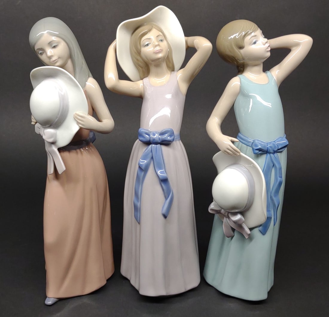 3 Lladro Sun Hat Girl Figures (#5011, 5010, 5007): 3 Lladro porcelain figurines including #5011 Coy girl, #5010 Prissy girl, #5007 Bashful girl w/ straw hat. All are in good condition, no chips or cracksIn-house International shipping NOT available fo