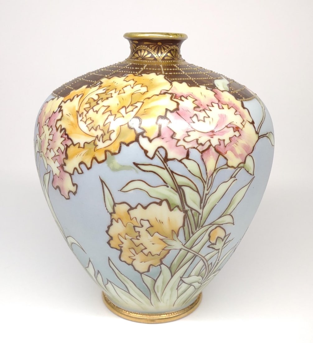 Nippon Art Nouveau Floral Brickwork Vase: Antique, circa late 19th/early 20th century, hand painted porcelain Japan Nippon vase. decorated with art nouveau pink and yellow flowers on a light blue base. Accented with gold and brown brick patte