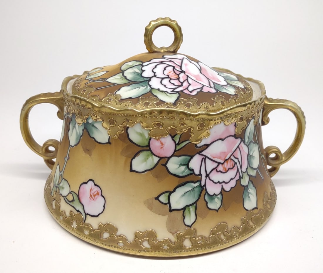 Nippon Art Nouveau Rose Cracker / Biscuit Jar: Antique, circa late 19th/early 20th century, hand painted porcelain Japan Nippon Art Nouveau biscuit/cracker jar. Featuring Art Nouveau style dark outlined pink roses with orange background. Decorated