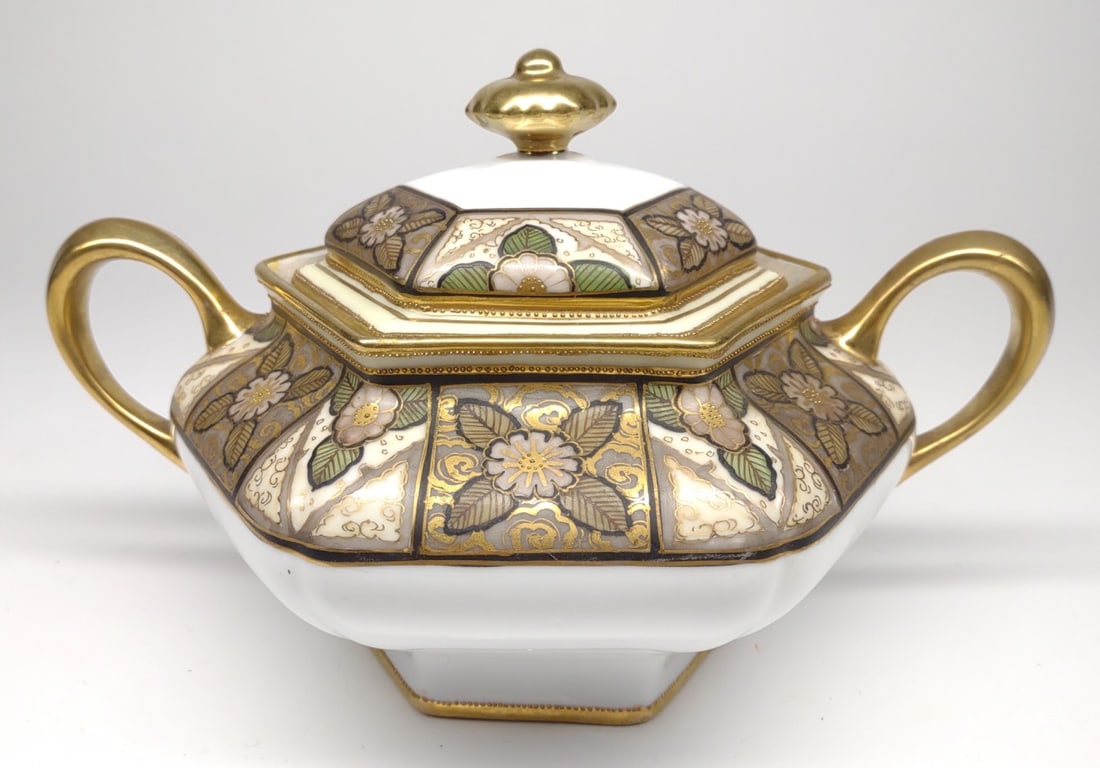 Nippon Floral Decorated Cracker / Biscuit Jar: Antique, circa late 19th/early 20th century, hand painted porcelain Japan Nippon double handled cracker / biscuit jar. Featuring painted pink floral patterns decorated with gold detail and gold beadin