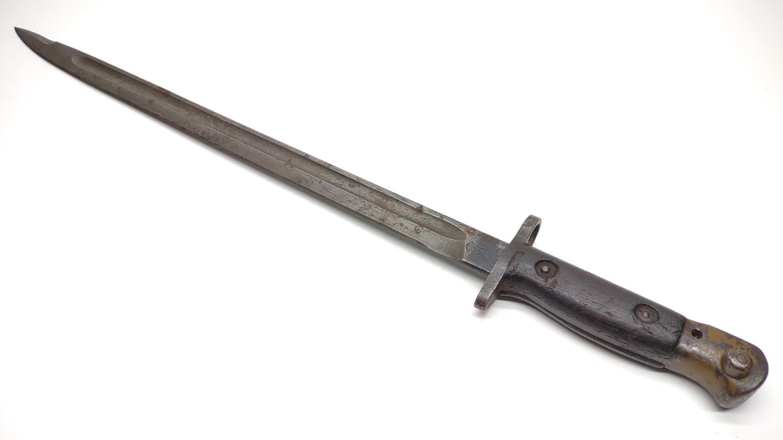 WW1 1907 Wilkinson Enfield Rifle Bayonet: WWI 1907 Wilkinson bayonet for the Enfield rifle. Ricasso of blade is marked "1907 9 17" and other indistinguishable markings on both sides. Blade measures approximately 16.75" long and approximately 