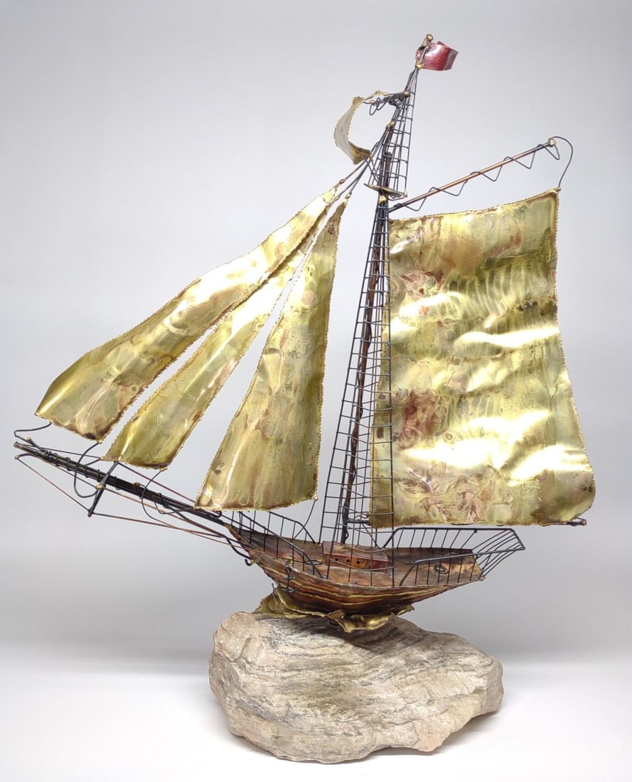 Vintage 34" Mid Century Brass Sailboat Sculpture: Vintage Mid Century Modern brass construction sail boat sculpture on stone base. Ship measures approximately 34" tall from stone base to top of mast.NOTE: In-house international shipping NOT available