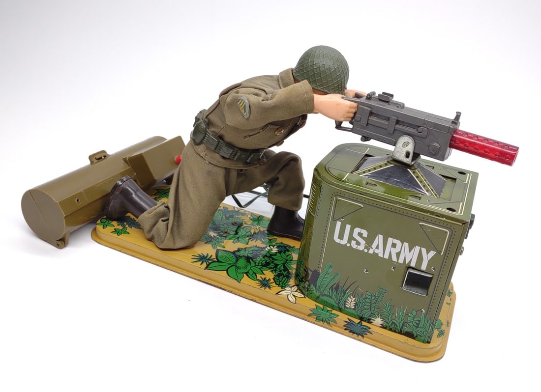 Vintage Japan Tin US Army Soldier Battery Op Toy: Vintage made in Japan tin litho US Army soldier battery operated cap strip shooting toy. Toy is tested and working, barrel of machine gun lights up and firing mechanism functioning correctly. Toy meas