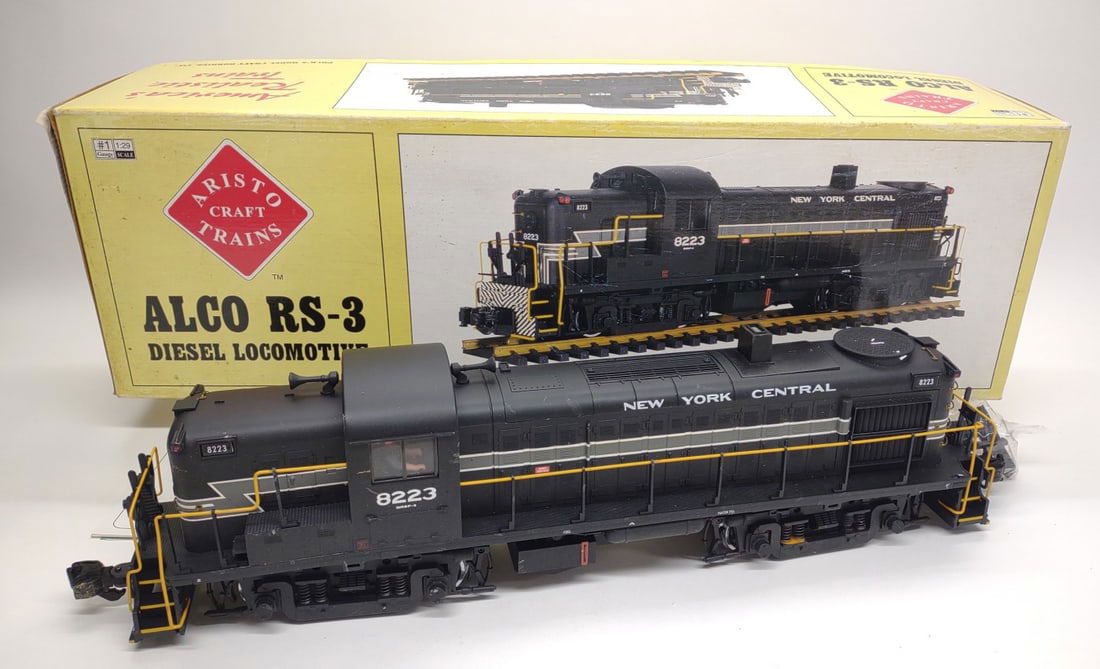 Aristo Alco RS3 ART-22219 Diesel Locomotive w/ Box: Aristo G Scale Alco RS-3 New York Central Diesel Locomotive ART - 22219 #8223 toy train in original box. Box measures approximately 27.5" long. Untested.