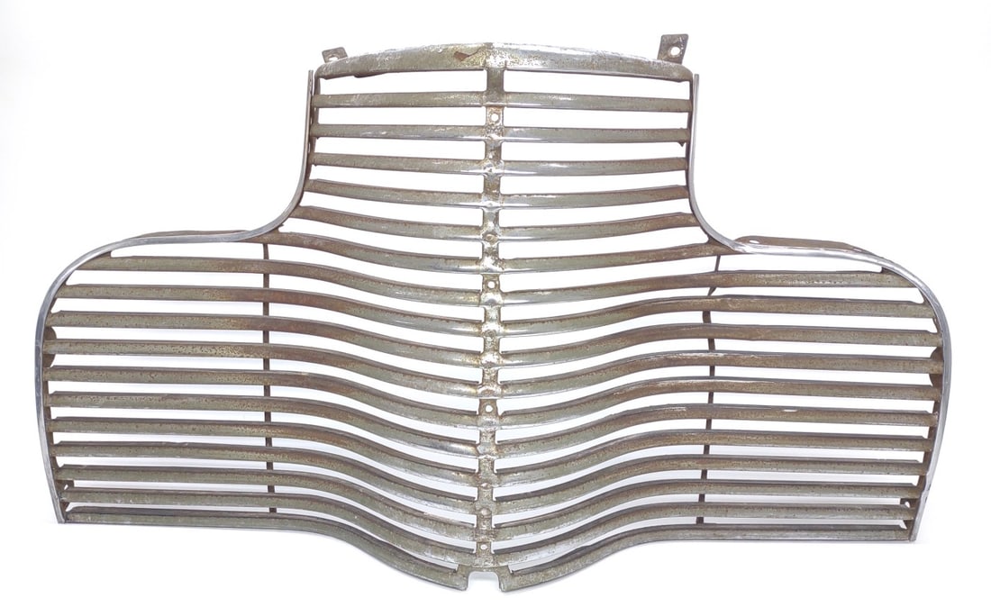 Vintage 1940 Chevrolet Special Deluxe Front Grille: Vintage 1940 Chevy Special Deluxe car front grille. Grille is in original condition. Grille measures approximately 33" wide.