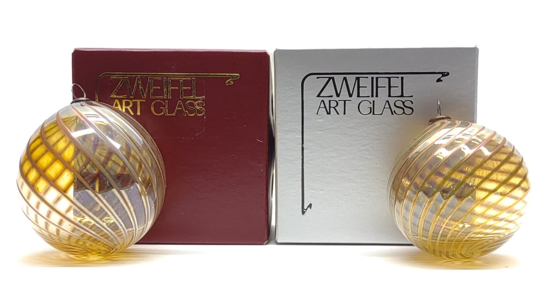 (2) Zweifel Art Glass Christmas Ornaments (Signed): (2) Vintage Craig Zweifel 3" diameter art glass Christmas tree ball shape spiral semi-transparent ornaments. First signed "Zweifel 1983" and second signed "Zweifel 1985" in good condition, no chips or