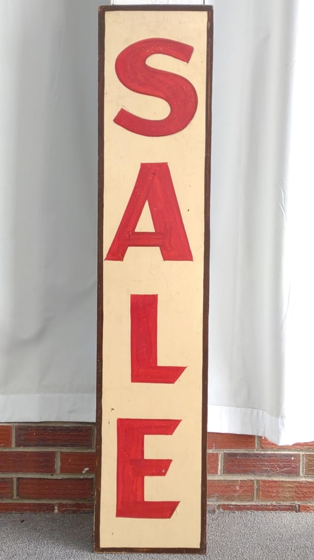 48" Antique SALE Wood Trade Sign: Antique wooden "SALE" hand painted advertising trade sign. Sign is decorated with red lettering reading "Sale" and a cream colored background with a black border. Sign measures approx.: 48 x 10 in. SH