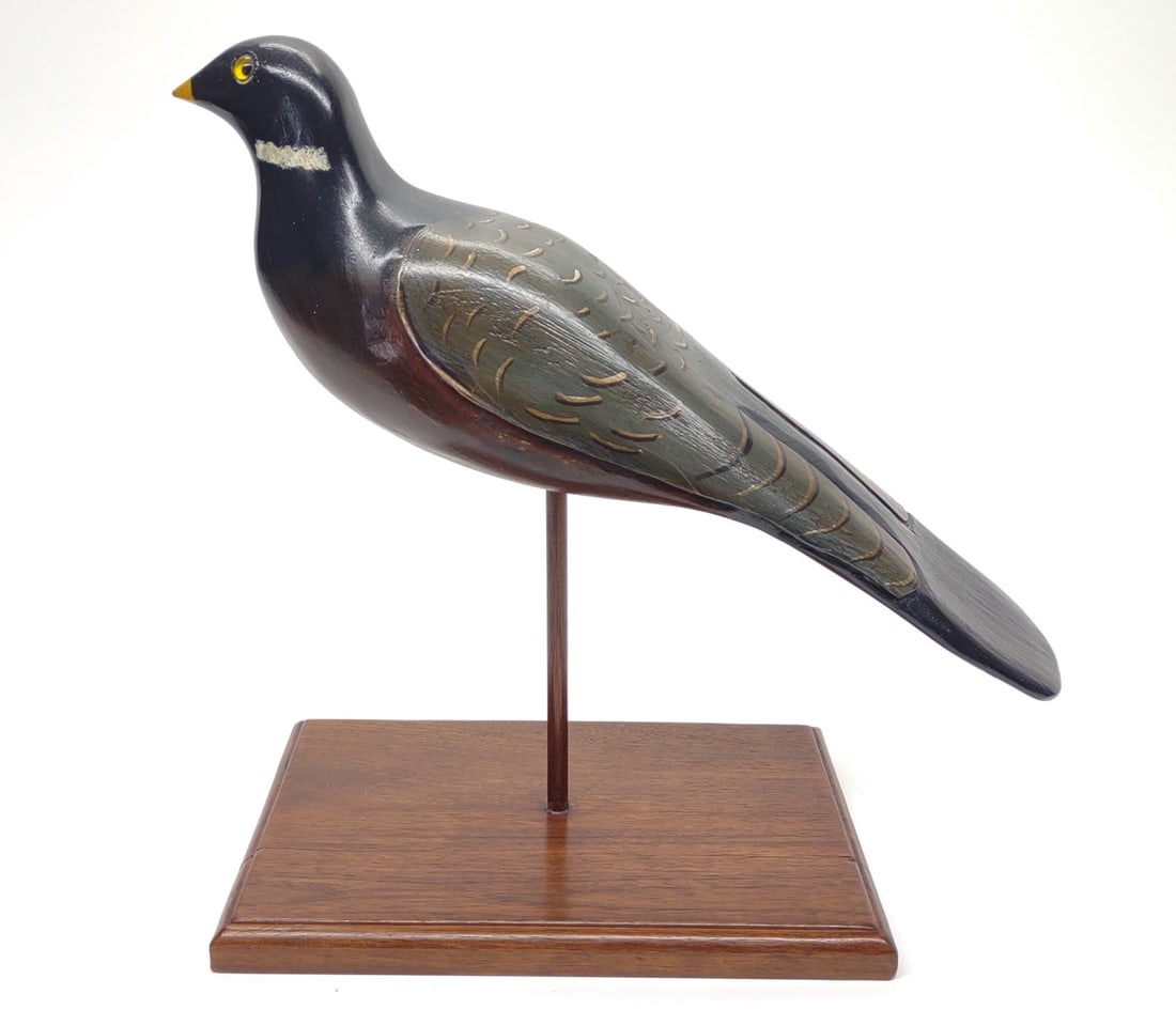 Doug Gates Carved Pigeon Decoy: Carved pigeon decoy mounted on stand by Douglas Gates, Chestertown, Maryland. Underside of stand is marked "M.D. Gates Quaker Neck Landing, Chestertown, Md". Bird measures 14" in length, and stands 12