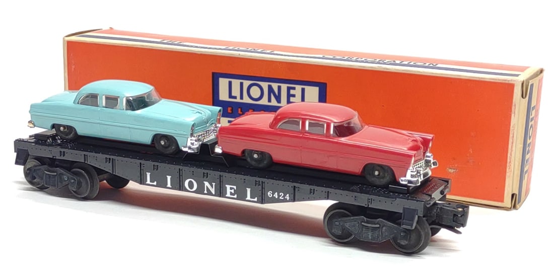 Lionel 6424 Automobile Flat Car Complete w/ Box: Vintage Post-War Lionel 6424 Automobile Flat Cartoy train, complete with box. Includes one red and one turquoise cars, with original cardboard car insert. Flat car and automobiles marked "The Lionel C