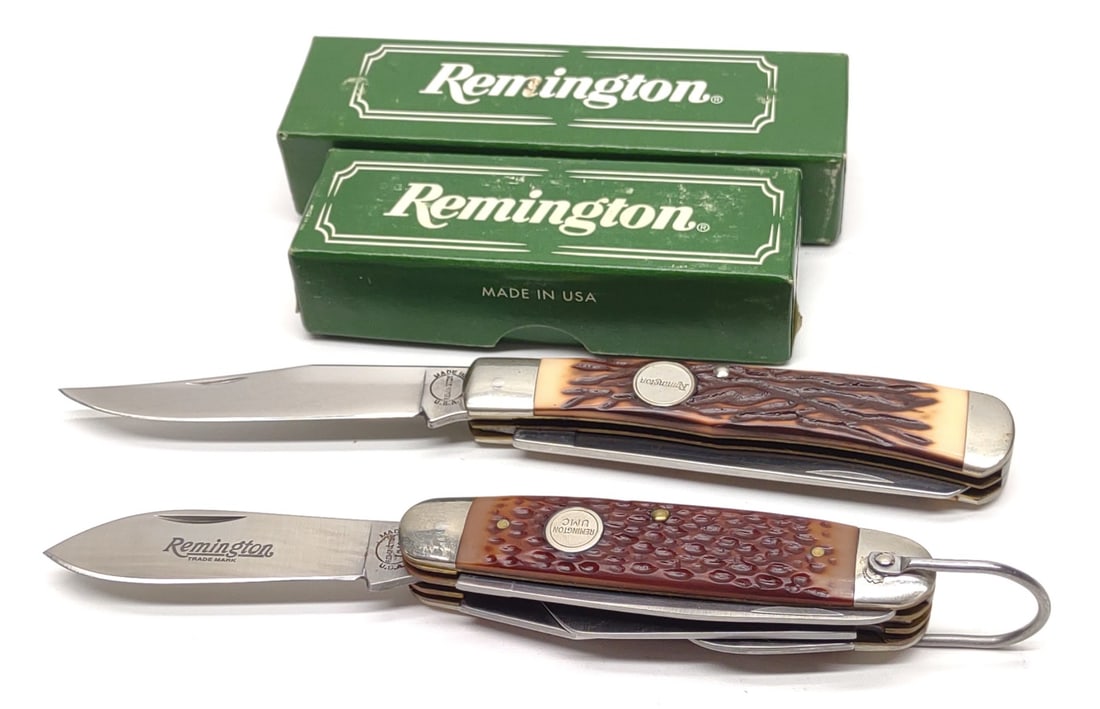 Remington Folding Knives (R-4 & R-12) w/ Boxes: (2) Remington pocket / folding knives including (1) R4 four blade pocket knife with original box, and (1) R12 two blade pocket knife with original box. Box measures approx.: 5 x 1 1/2 x 1 in. SHIPPING