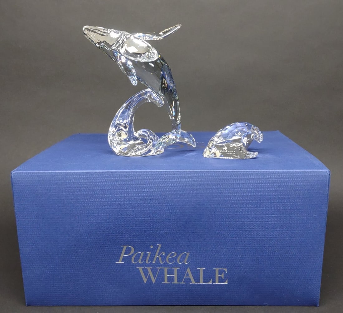 Swarovski Paikea Whale Crystal Figurine w/ Box: Swarovski crystal Paikea Whale art glass figurine. Model number: 1095228. Figure includes "Paikea 2012" plaque, and Swarovski original box. Measures approximately 6" tall. Both figure and plaque are i