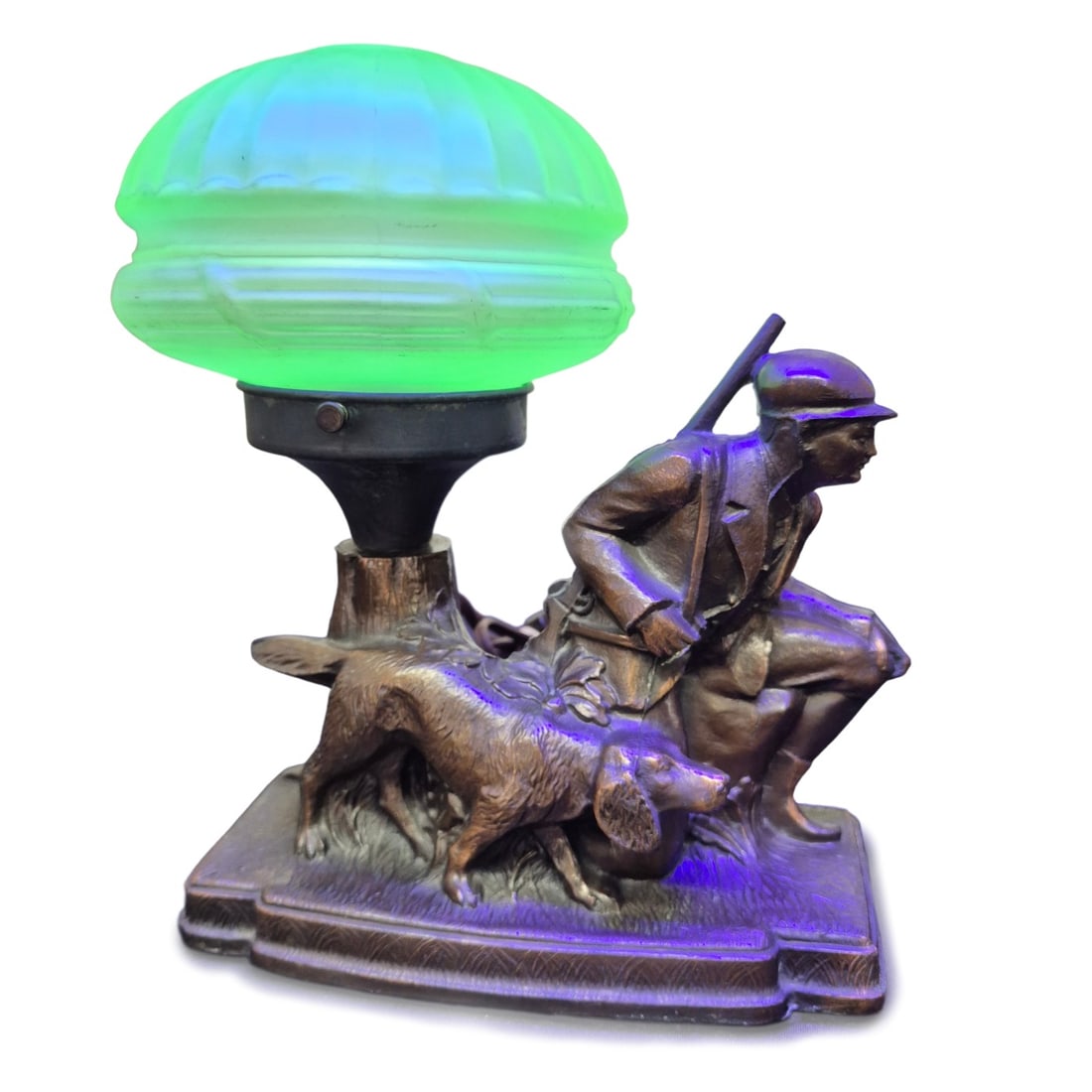 Art Deco Figural Hunter & Hound Uranium Lamp: Vintage Art Deco figural era hunter and dog desk lamp with uranium glass shade. Original cord and plug have been replaced. Tested and working. No chips or cracks in shade. Lamp measures approx. 10 x 8