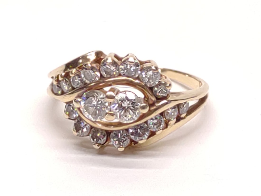 14K Gold & Diamond (1.15 ctw) Bypass Ring (sz 7): 14 karat yellow gold and diamond bypass ring. Features 18 round cut diamonds (1.15 cttw). Inner band is marked with jewelers mark "M". Has been tested for gold purity and diamonds. Ring size 7. Total