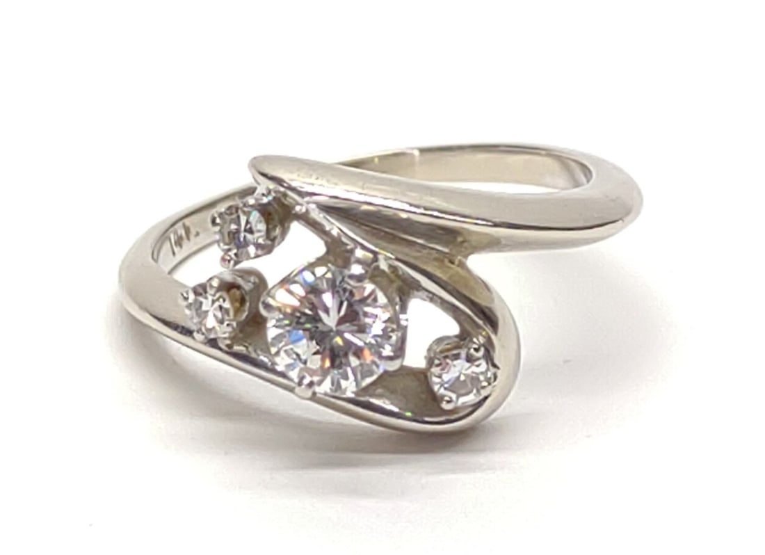 14K White Gold & Diamond 0.52 ctw Ring (sz 6.75): 14 karat white gold and diamond bypass swirl style ring. Featuring 4 round cut diamonds (0.52 cttw). Inner band is marked "14K" with "Star". Has been tested for gold purity and diamonds. Ring size 6.7