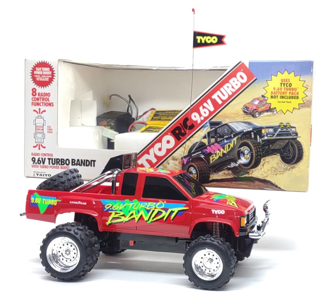Tyco R/C 9.6V Turbo Bandit Toy Truck & Box (Works): Vintage 1992 Tyco R/C 9.6V Turbo Bandit toy truck, complete in original box. Includes Bandit r/c truck, controller, (2) 9.6V batteries, 9.6V battery charger, original box, and manual. R/C truck, contr