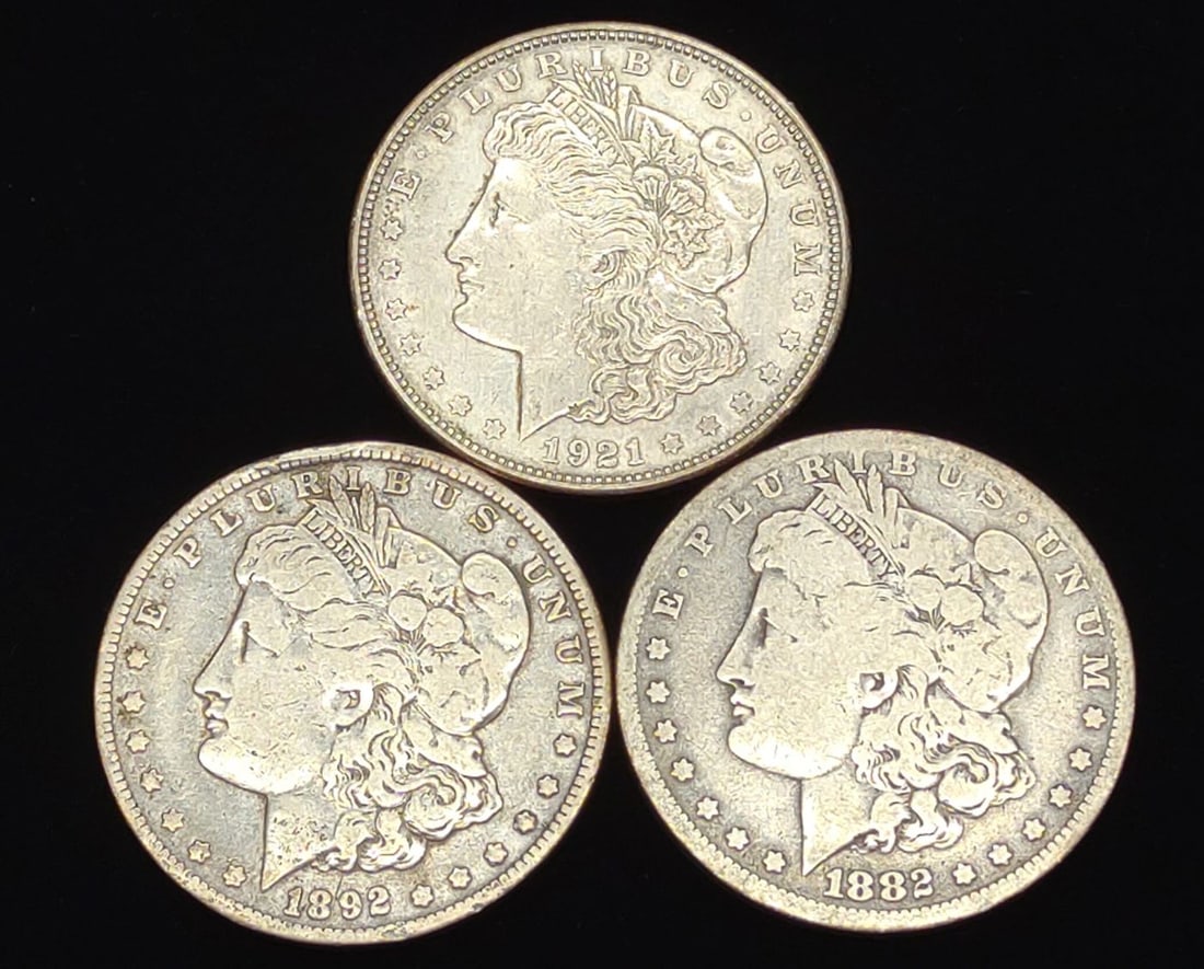 3 Morgan Dollar US Coins (1882-O, 1892-O, 1921-D): 3 Morgan Dollar 90% silver US coins including: (1) 1882 O, (1) 1892 O, and 1921 D. FV: $3.00. Designer: George T. Morgan. SHIPPING OPTIONS AVAILABLE: UPS 'Pack & Ship' or LiveShipping. In-house shippi