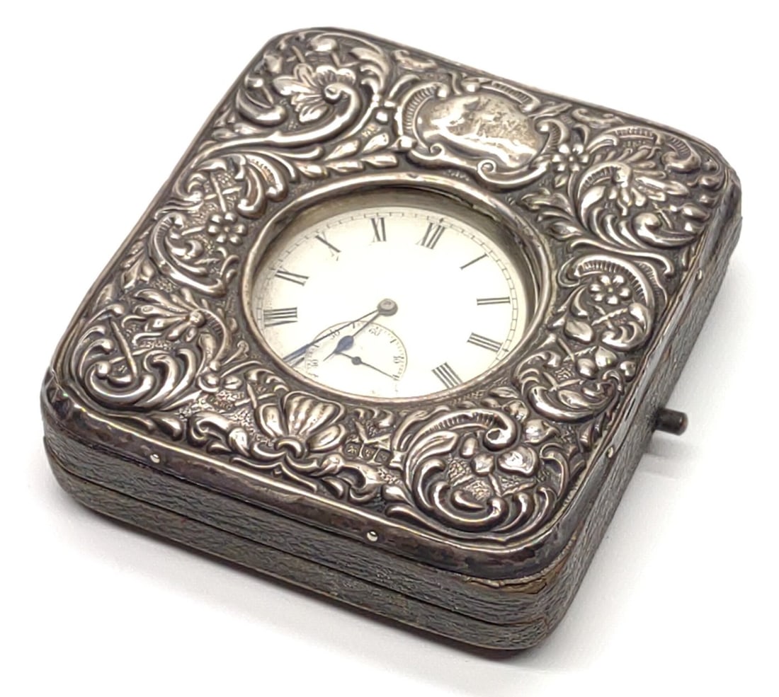 1887 Sterling Silver Pocket Watch & Sterling Case: Antique, 1887, sterling silver london pocket watch with sterling silver and leather Repousse open display tabletop case. Pocket watch is in working condition, winds, ticks, and keeps time. Inner watch